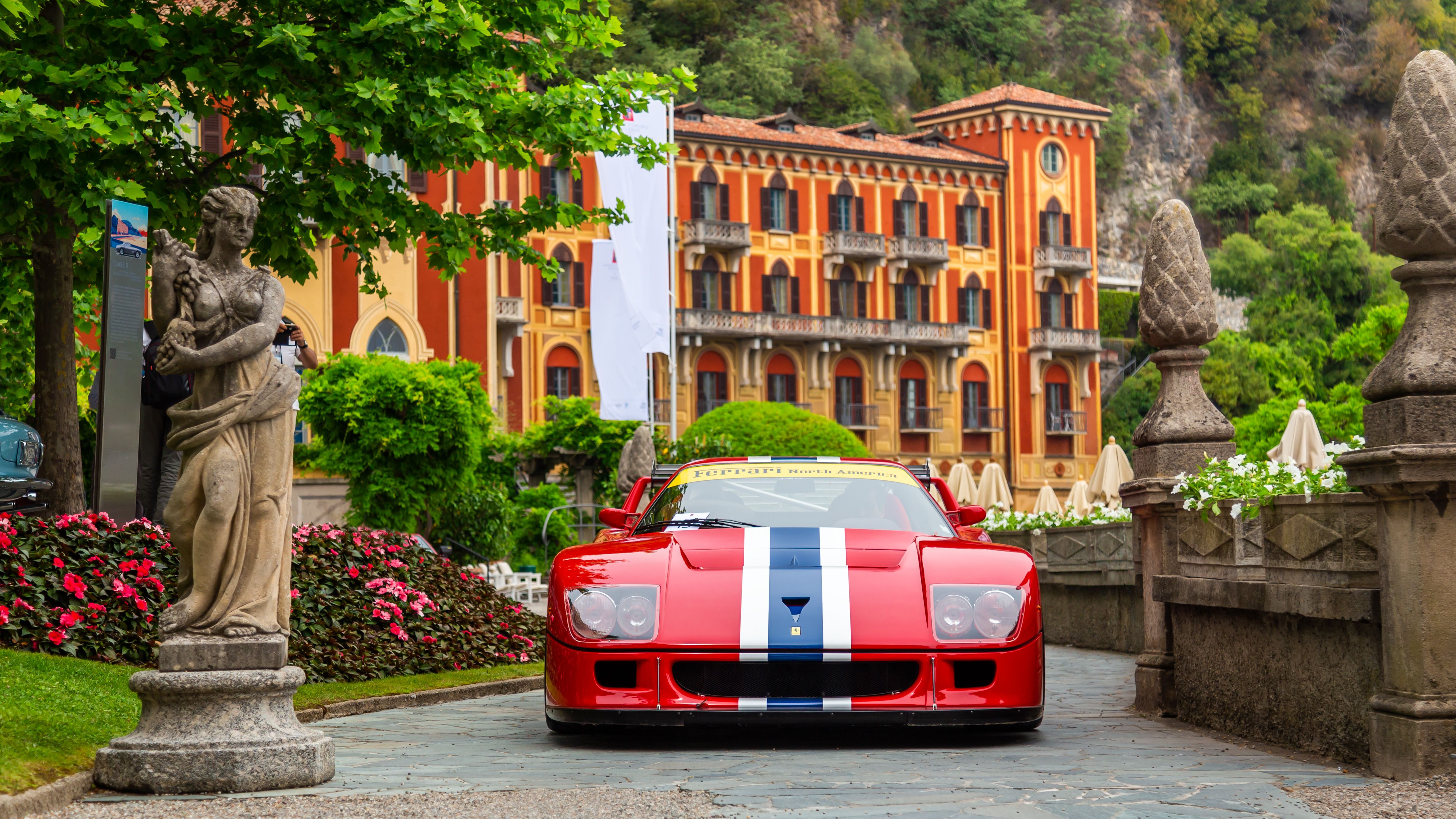 Red Ferrari F40 front view parked in an Italian piazza